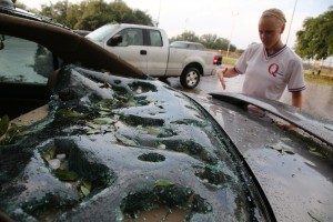 Inspecting hail damage. AP Photo/The Dallas Morning News, Nathan Hunsinger