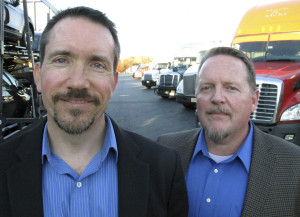 Scott Cornell, left, and Douglas "DZ" Patterson, theft investigators for The Travelers Cos., pose at a truck stop in Willington, Conn. Cornell and Patterson work to prevent cargo theft, including deploying a "sting trailer" packed with hidden surveillance equipment. Cargo theft has become a huge problem that the FBI says causes $15 billion to $30 billion in losses each year in the U.S. There were 152 cargo thefts nationwide in July, August and September. (AP Photo/Dave Collins)