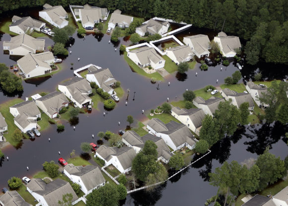 This aerial photo show flooding around homes in the Carolina Forest community in Horry County, between Conway and Myrtle Beach, S.C. The state was  pummeled in early October by a historic rainstorm that caused widespread flooding and multiple deaths. (Janet Blackmon Morgan/The Sun News via AP)