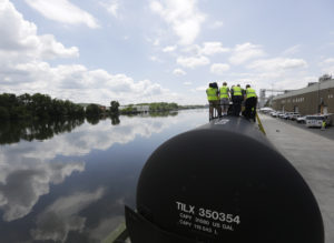 Firefighters and other first responders are familiarized with tank cars on the CSX Safety Train next to the Hudson River in the Port of Albany on Thursday, June 5, 2014, in Albany, N.Y. The train is equipped with four oil tankers and two classroom cars and is making a whistle stop in Albany as part of a multi-state tour providing enhanced safety training in response to increased shipments of North Dakota crude oil. Albany has become a major hub for shipping the crude oil, which arrives daily in hundreds of tank cars to be shipped down the Hudson to New Jersey refineries. (AP Photo/Mike Groll)