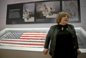 Shirley Dreifus, the original owner of the American flag, left, that firefighters hoisted at ground zero in the hours after the 9/11 terror attacks, speaks during an interview at the Sept. 11 museum, Thursday Sept. 8, 2016, in New York. After disappearing for more than a decade, the 3-foot-by-5-foot flag goes on display Thursday at the museum with assistance from Chubb Insurance.  (AP Photo/Bebeto Matthews)