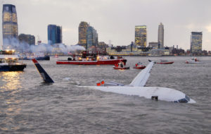  In this Thursday, Jan. 15, 2009 file photo, an Airbus 320 US Airways aircraft that went down in the Hudson River is seen in New York. A reader-submitted question about pets in the cargo hold of Flight 1549 is being answered as part of an Associated Press Q&A column called "Ask AP". (AP Photo/Edouard H. R. Gluck)