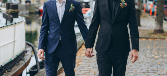 Stylish gay couple on a wedding day, same sex couple marriage.