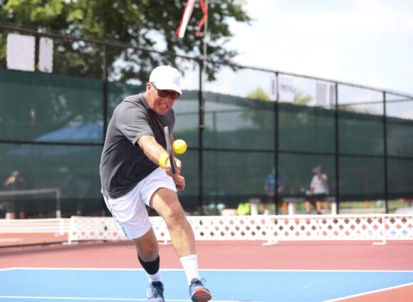 A gentleman competes in a pickleball tournament