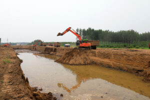 LUANNAN COUNTY, Hebei Province, China - July 11, 2020: Excavator operation in flood control engineering construction site