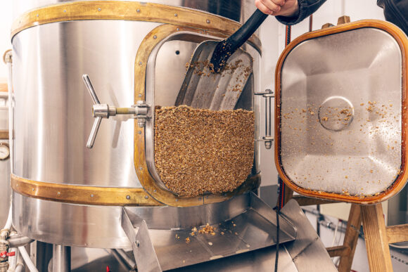 Mashing of milled malt grains for preparing malt. Process of brewing grain of barley.