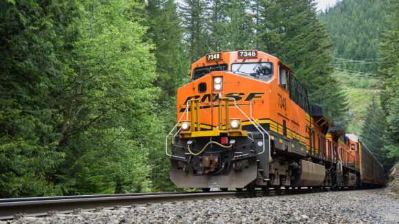 Skykomish, WA, USA - May 24, 2016; BNSF freight train hauls auto racks on the Scenic Subdivision in the Cascade Mountains of Washington State