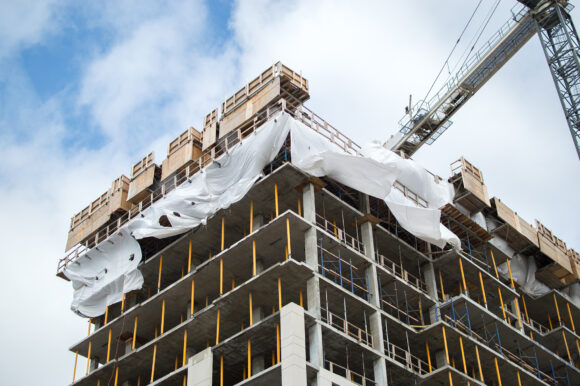 Construction of the modern condo buildings with huge windows and