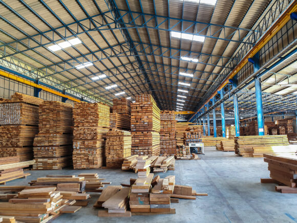 Lumber - Wood factory stock or timber in warehouse. ,Piles of wo