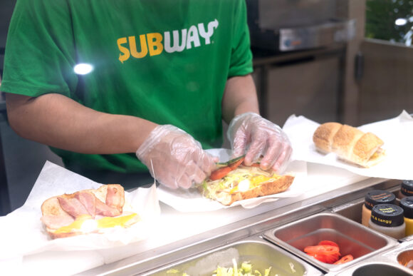 Bangkok, Thailand - January 9, 2021 : Staff is cooking sandwich at Subway restaurant. Subway is an American fast food restaurant franchise that sells sandwiches and salads.