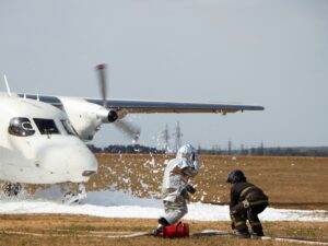 Firefighters extinguish a fire on an airplane after a plane crash.