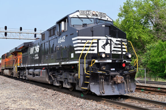 Naperville, Illinois, USA. Led by a freshly painted off-road Norfolk Southern Railway locomotive a Burlington Northern Santa Fe freight train passes through northeastern Illinois on its journey to Chicago. The highly active stretch of tracks, shared with Metra, Chicago's commuter railroad network, is often called the 'Racetrack' due to its heavy train volume. The freight moved over this line connects Chicago with a wide variety of southwestern, western and northwestern destinations in the United States including the country's West Coast.