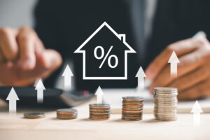 The real estate market flourishes, highlighted by an upward graph and an up arrow. A house model and coin stack portray inflation, economic growth, and insurance service prices. Property value gains.