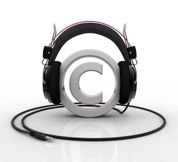Copyright symbol wearing headphones