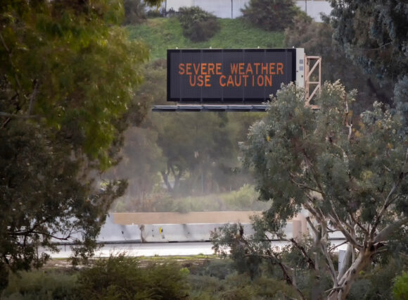 Digital road sign stating Severe Weather Use Caution on the 15 freeway in Escondido California