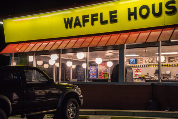 Calvert City, KY, US-December 2, 2021 : Waffle House exterior at night. Waffle House, is an iconic restaurant chain with more than 2,100 locations in 25 states in the United States.