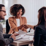 Woman shaking hands after successful job interview