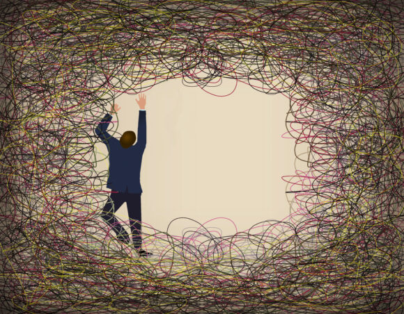 A man in a suit climbs and struggles against a tangle of colored lines of wire in an illustration about overcoming any difficult situation.