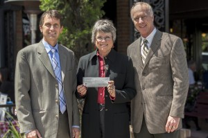 Mitch Dunford and Bryan A. Anderson present IICF donation to shelter director Rosemary Johnston.