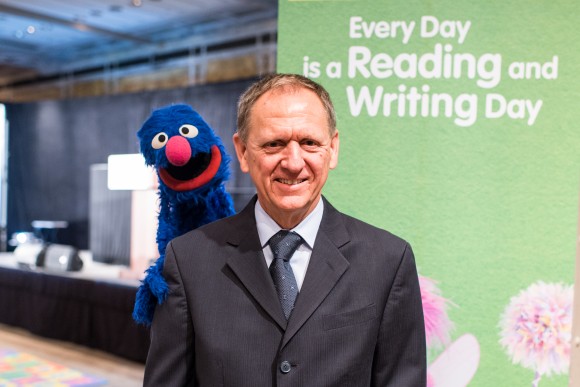 Bill Ross, CEO of the Insurance Industry Charitable Foundation, with Grover of Sesame Street, the long-running PBS-TV kids' educational program